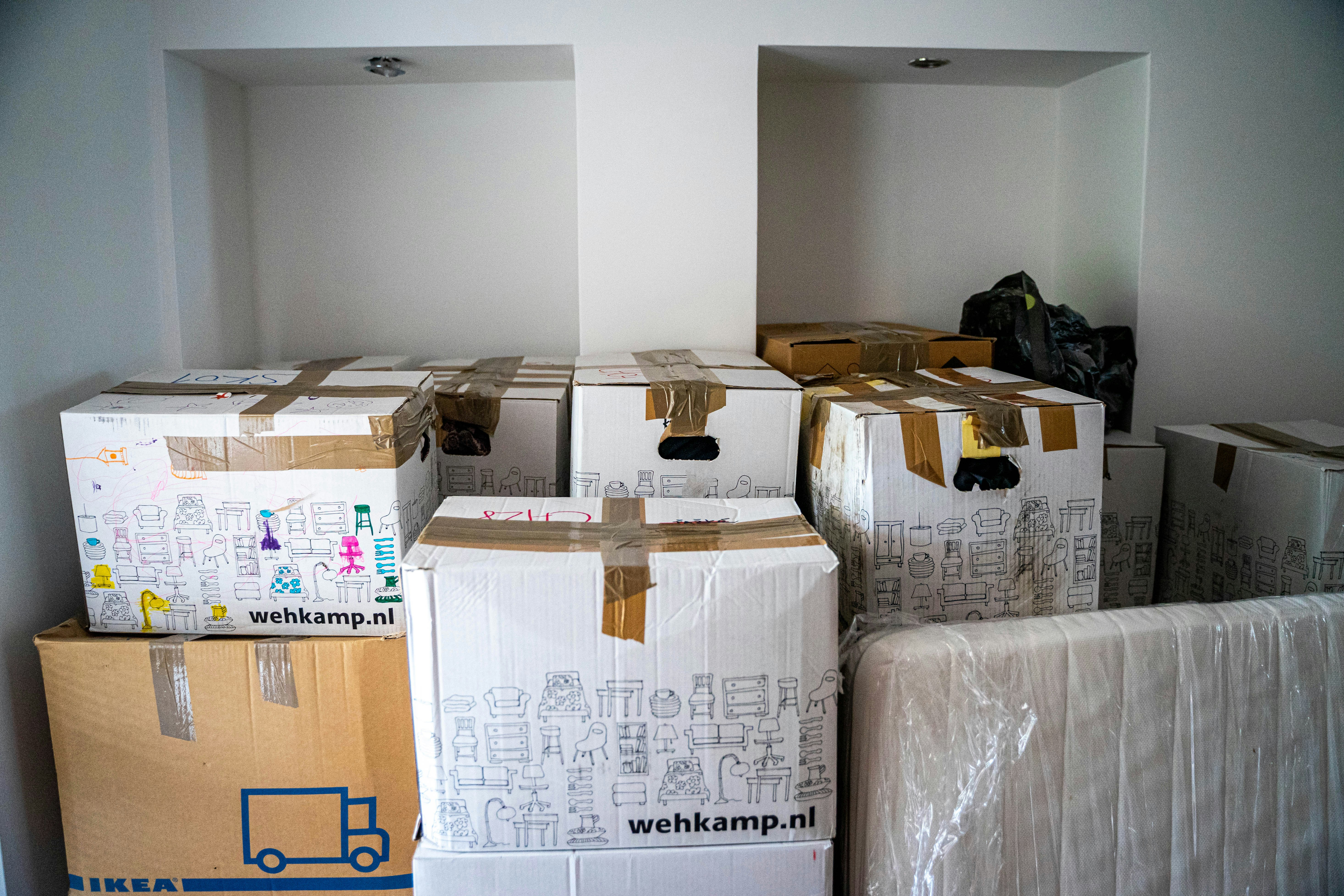 Moving boxes packed and ready in a room